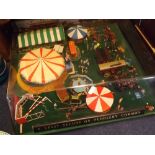 Table top Perspex cased miniature fairground with a title of A Split Second on Puddlesby Common,