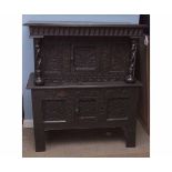 18th century and later small carved oak court or storage cupboard, the top section with dentil