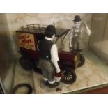 Glass cased Laurel & Hardy with a vintage car, 18ins x 12ins