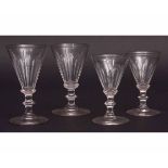 Collection of 19 various 19th and 20th century facetted conical wine glasses, many with knopped