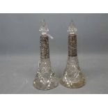 Pair of clear glass silver mounted scent bottles with matching conical stoppers, with faceted