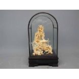 Decorative dome glazed cased carved cork sculpture of a pagoda house over a rocky landscape with