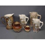 19th century graduated set of three jugs with printed scenes of a church, together with a Beswick