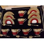 Boxed set of six Ainsley cups and saucers with gilded floral border, in a presentation case, with