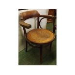 Bentwood armchair with circular penny seat, shell motif on splayed feet