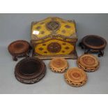 Nine assorted hardwood circular stands of varying sizes, together with a further pine box with