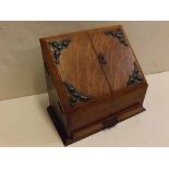 19th century oak letter rack with sloped front, two open doors, compartmentalised interior, fitted