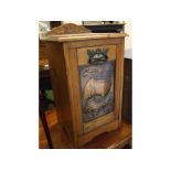 Arts and Crafts oak coal purdonium with decorative inset copper panel with pressed detail of a ship,