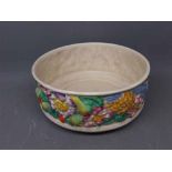 Clarice Cliff bowl with raised and coloured floral border with printed mark to base, 9ins diam