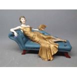 Resin painted Coalport reclining figure on a Chesterfield entitled ?Roaring Twenties Penny? modelled