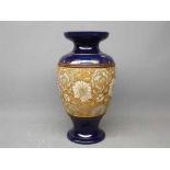 Doulton Lambeth Slaters vase with blue glaze with painted floral detailing, 12ins tall