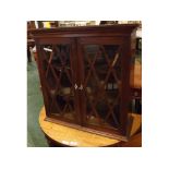 19th century mahogany wall mounted cupboard with two astragal glazed doors with ivory escutcheon,