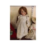 Schoenau & Hoffmeister German bisque head doll stamped SH PB 1909 further impressed 21/2, auburn