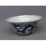 20th century Chinese bowl decorated with blue printed dragon design, with six character mark to