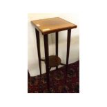 Edwardian walnut and inlaid square topped plant stand on tapering square legs, top measuring 11ins