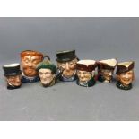 Eight miniature Toby Jugs to include Robin Hood, Auld Mac, Dick Turpin and Old Charlie, Mr Micawber,