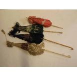 Three assorted bone and ivory handled parasols, together with a treen handled parasol with