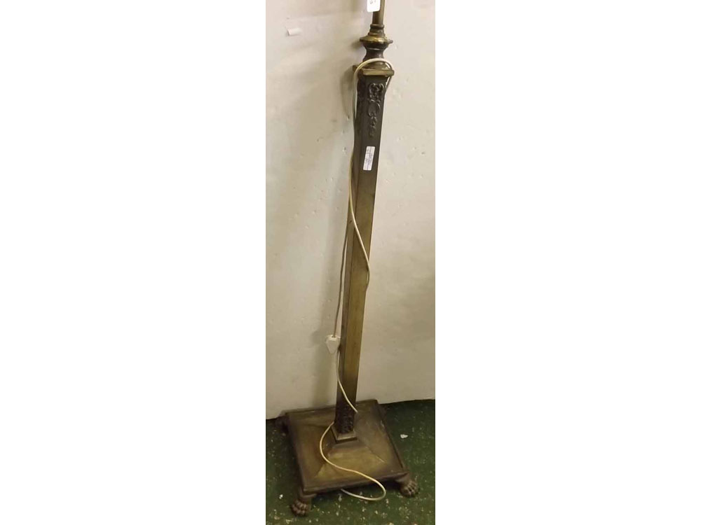 20th century brass square columned adjustable standard lamp with a square base on paw casters,