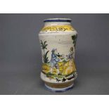 20th Century Italian pottery vase with decorative painted figures in a landscape scene, 9ins tall