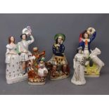 Five assorted Staffordshire type figures to include The Soldiers Return, a further seated Scottish