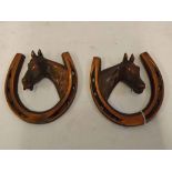 Two 20th Century coppered horseshoe ornaments with horse mounts to centre, 6ins wide x 5 1/2 ins