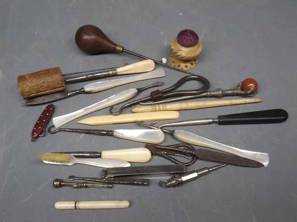 Bag containing a quantity of bone and mother of pearl handled manicure pieces together with a bone