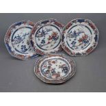 Four Chinese export octagonal plates with painted pagoda and mountain scenes, varying styles, each