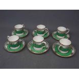 Six coffee cans and saucers by Minton, with a green stripe, painted stylised flowers (12)