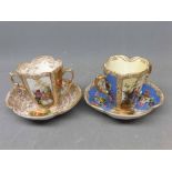 Two 19th century Augustus Rex two-handled cabinet cups and saucers with decorative printed scenes (