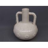 Burmantofts white two-handled vase with raised floral lozenges and impressed mark to base, 9 1/2 ins