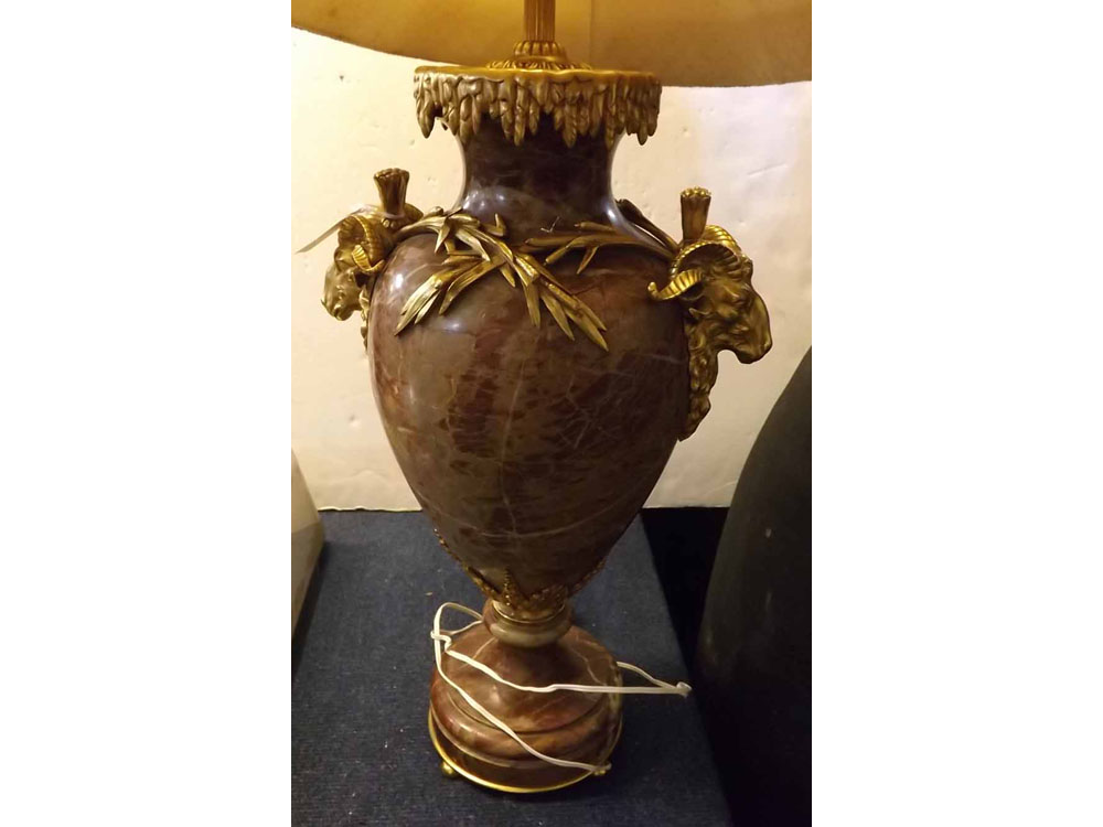 Good quality red marbled urn formed lamp with decorative gilt metal rams head handles, reed