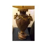 Good quality red marbled urn formed lamp with decorative gilt metal rams head handles, reed