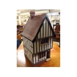 Modern dolls house with opening sides, split two-tier level in the form of a Tudor house, 15ins x