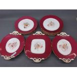 19th century dessert set with central painted floral decoration, maroon border and gilded rim,