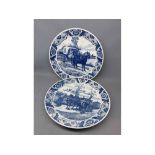 Pair of large Dutch Delft chargers with blue and white printed horse and cart scenes, 15ins diam