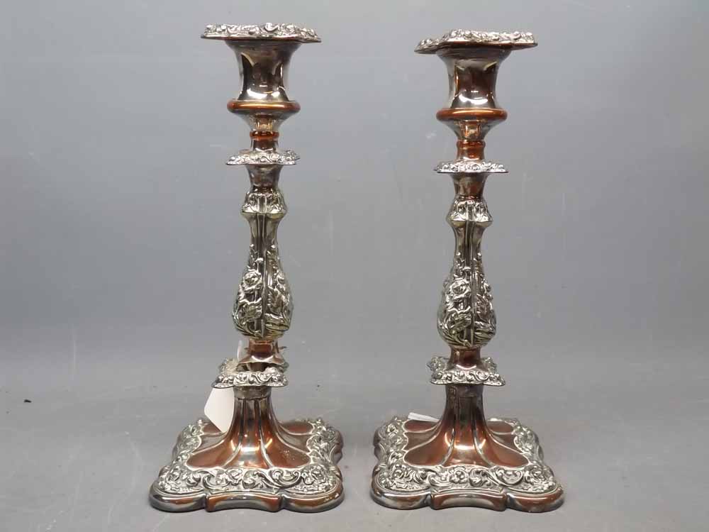 Pair of Victorian silver plated on copper candlesticks of square form with a knopped column,