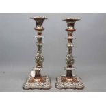 Pair of Victorian silver plated on copper candlesticks of square form with a knopped column,