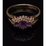 Modern yellow metal amethyst and diamond cluster ring, the three graduated circular amethysts raised