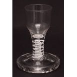 19th century firing glass with opaque twist stem on a heavy spreading circular foot, 4 1/2 ins high