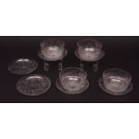 Set of four decorative finely engraved glass finger bowls and six saucers, engraved with game