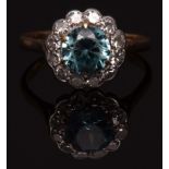 Blue zircon and diamond cluster ring, the blue zircon (8mm diameter), surrounded by twelve single