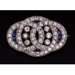 Early 20th century diamond and sapphire brooch, the open work plaque, a circle interlocked with