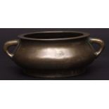 Small Chinese twin-handled circular bronze censer of squat form, the base with cast six character