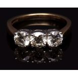 Diamond three stone ring, set with a row of circular brilliant cut diamonds each 0.60cts approx,