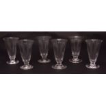 Six various jelly glasses, all with serrated rims, tapering faceted lower bodies on circular