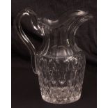 Early 19th century faceted glass jug with star cut foot, 8 1/2 ins high