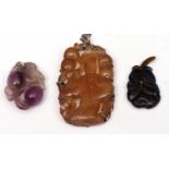 Mixed Lot: Chinese amber coloured hardstone carved pendant depicting a figure standing within a