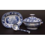 Wedgwood sauce tureen, stand, cover and ladle, of oval shape, printed in blue with the Landscape and