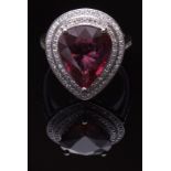 Modern ruby and diamond ring, set with a pear cut ruby 6.25ct approx, within a two tier diamond