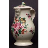 Cream ware jug with entwined handle, beadwork around rims and a cherub mask spout, matching lid,